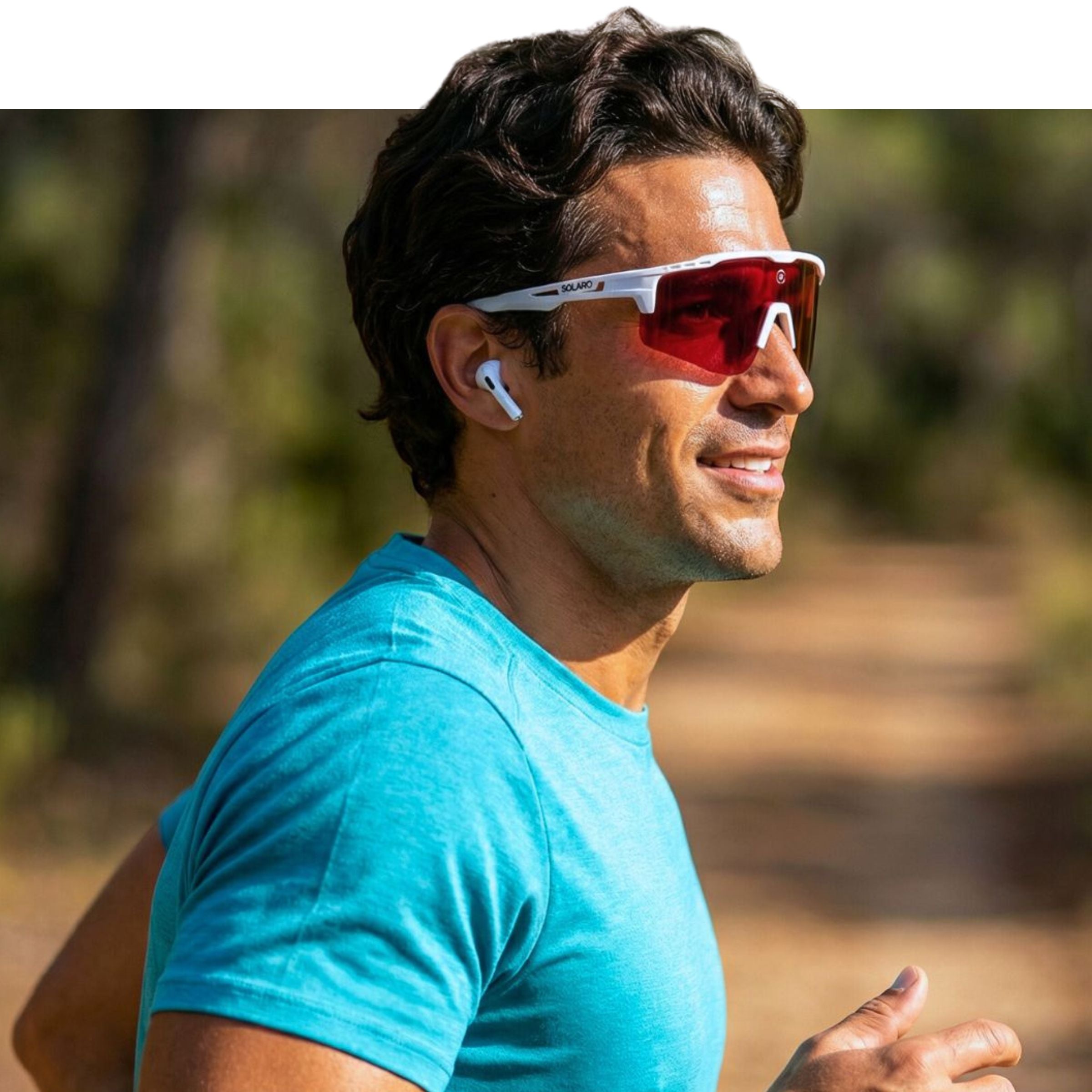 Man wearing red Solaro Shades White Hot sports sunglasses and a blue shirt outdoors