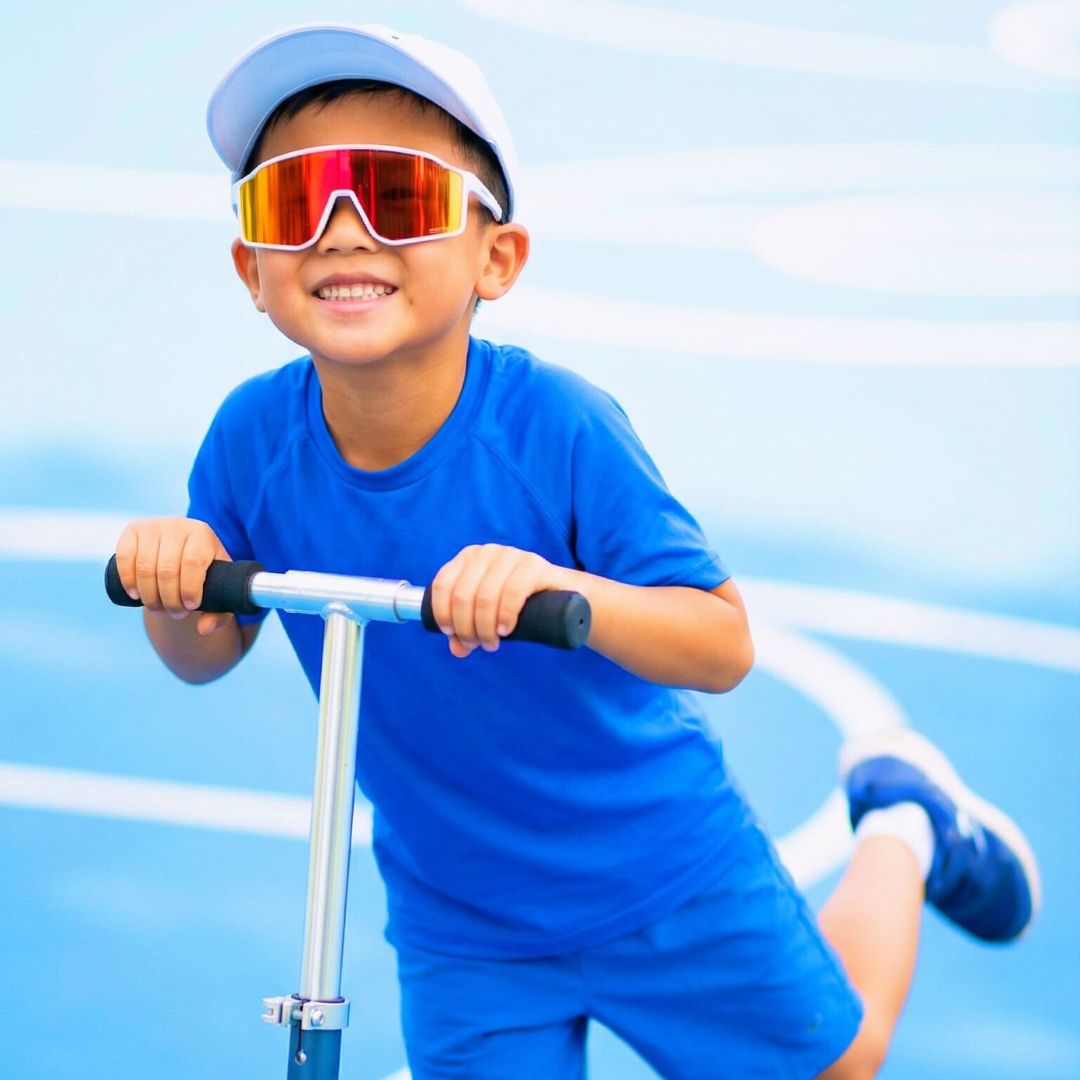 Kid wearing kids sunglasses from Solaro Shades youth sunglasses.