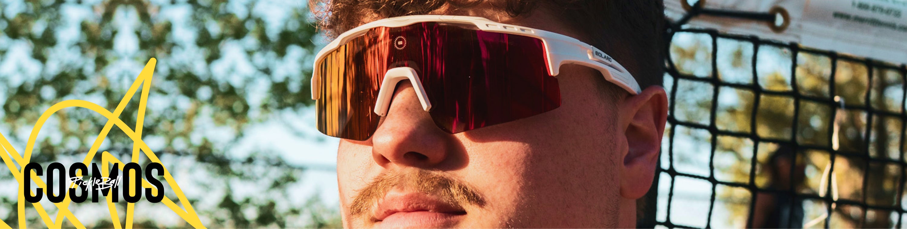 A pickleball athlete wearing Solaro Shades pickleball glasses, with interchangable lenses.