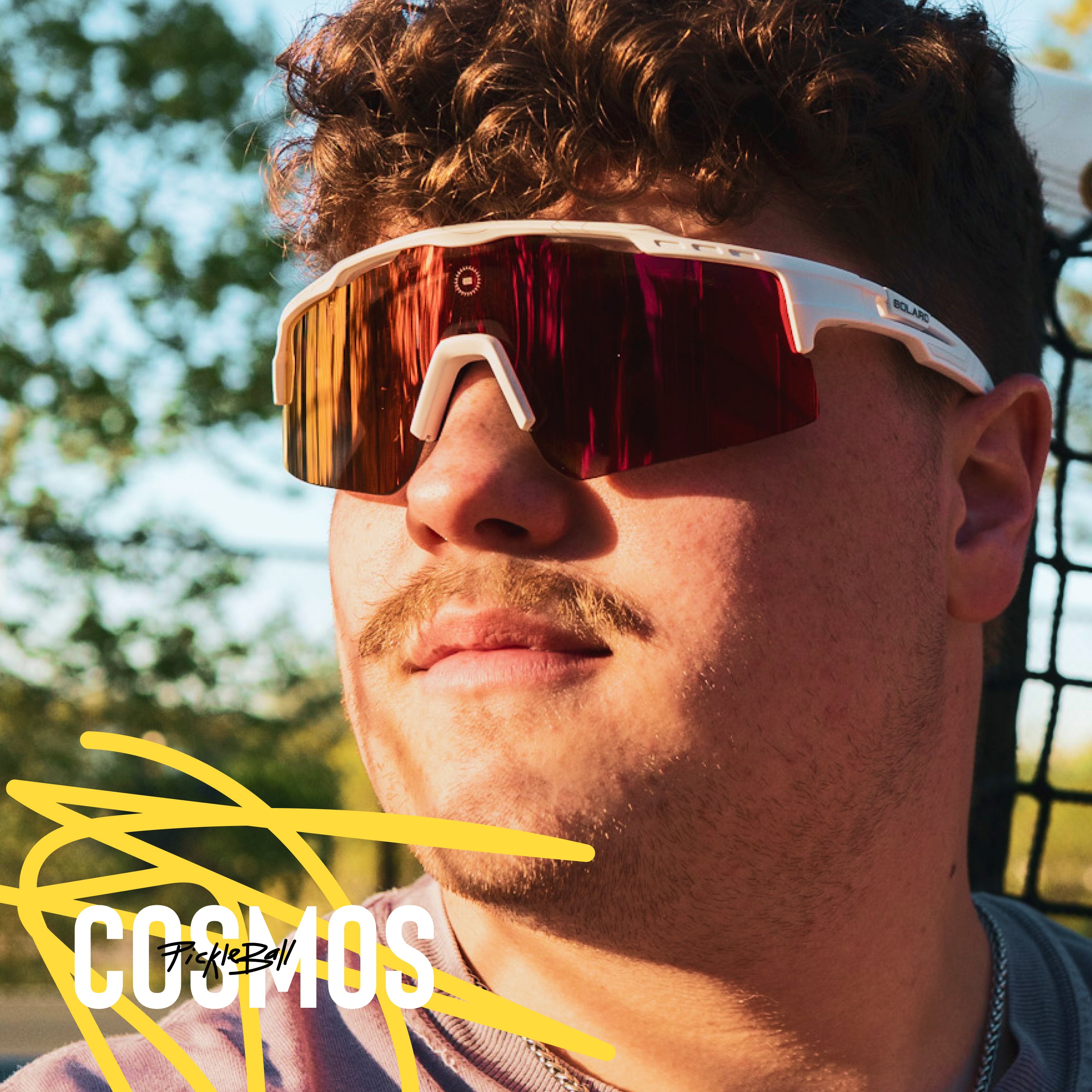 A pickleball athlete wearing Solaro Shades pickleball glasses, with interchangable lenses.