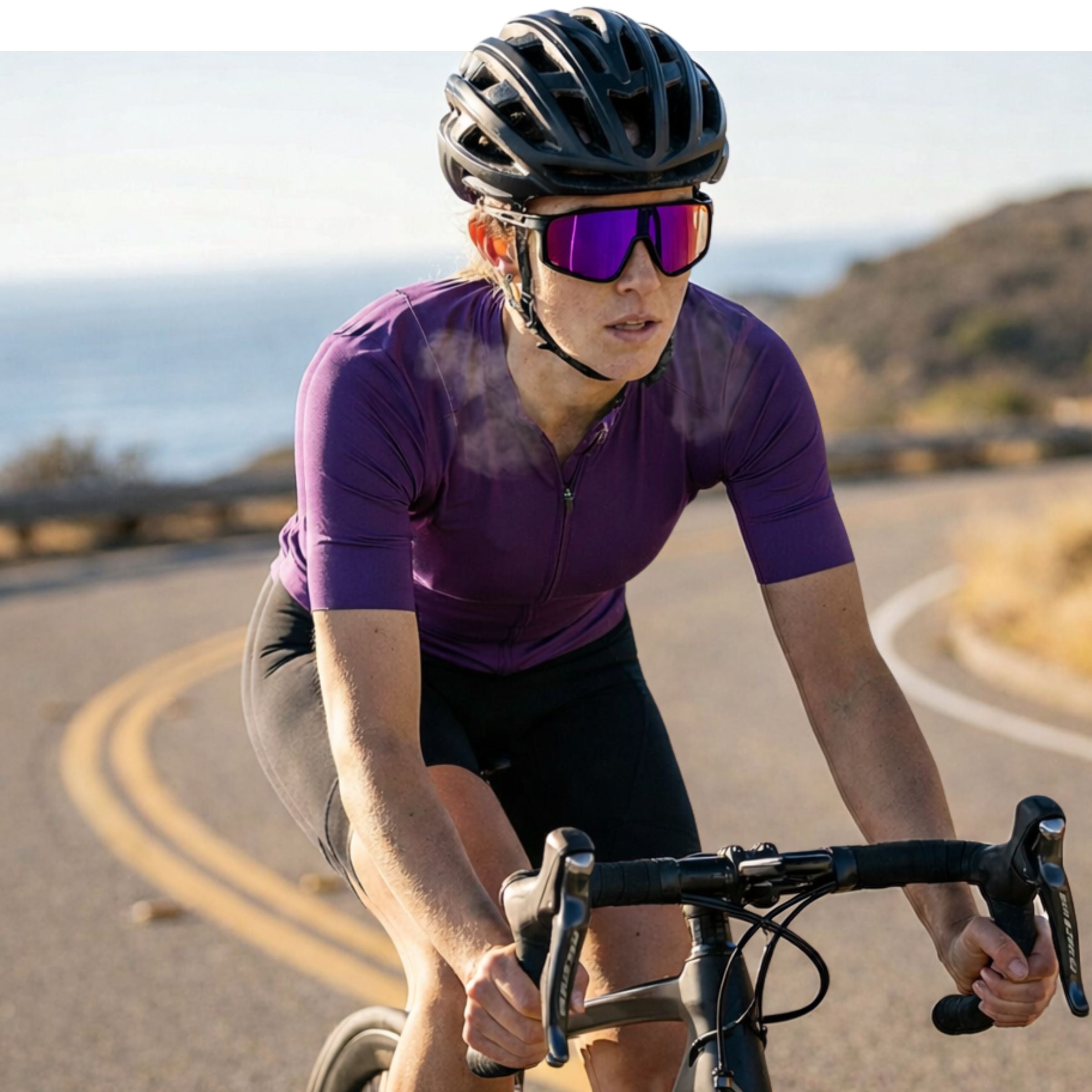 A female cyclist wearing Solaro Shades cycling sunglasses