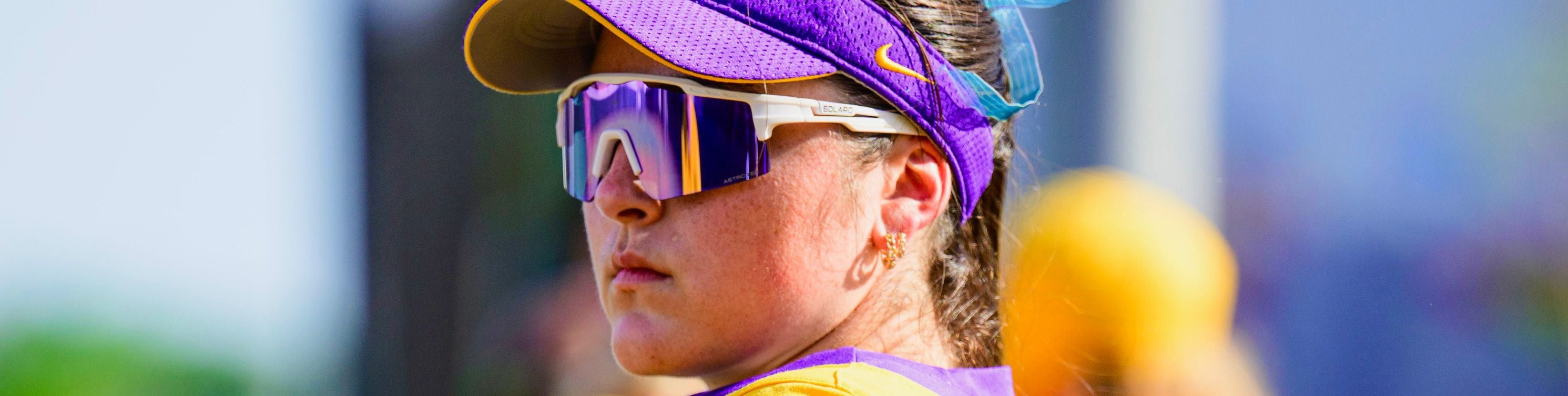 LSU softball player posing in Solaro Shades baseball and softball sunglasses.