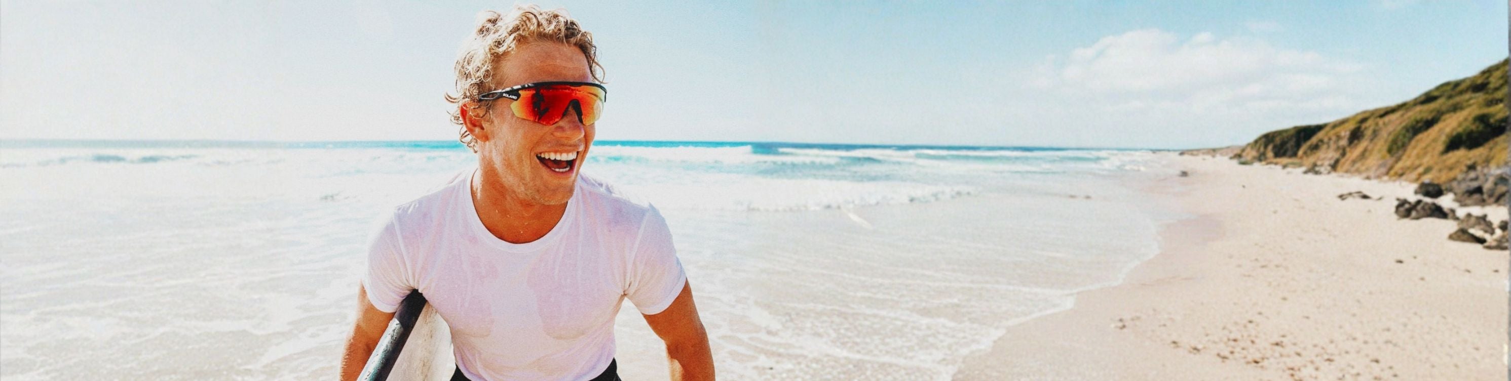 a surfer wearing solaro shades sports sunglasses.