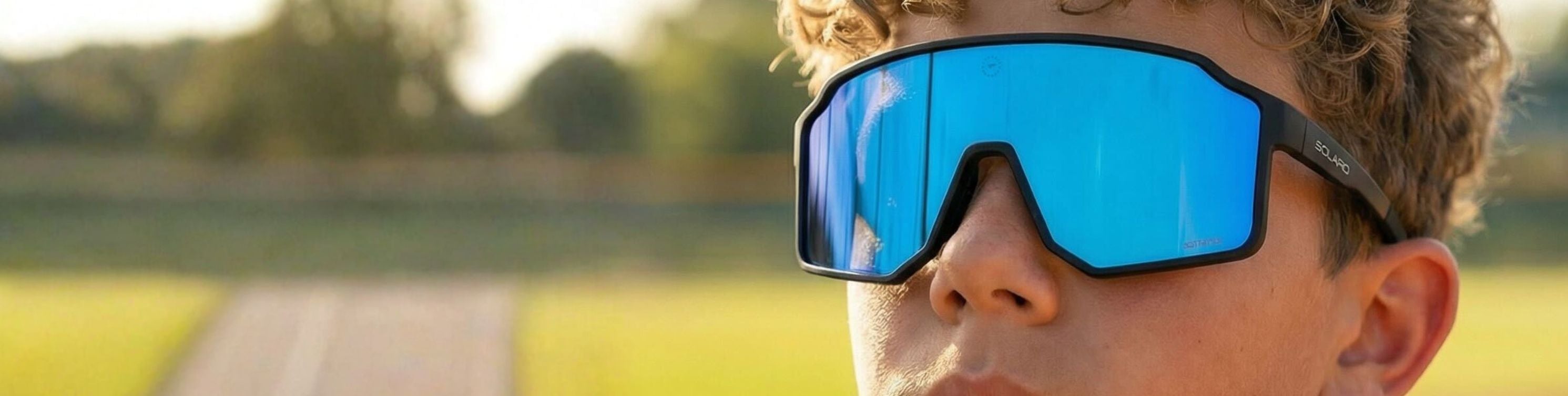 Young athlete wearing Solaro Shades youth sports sunglasses for baseball.