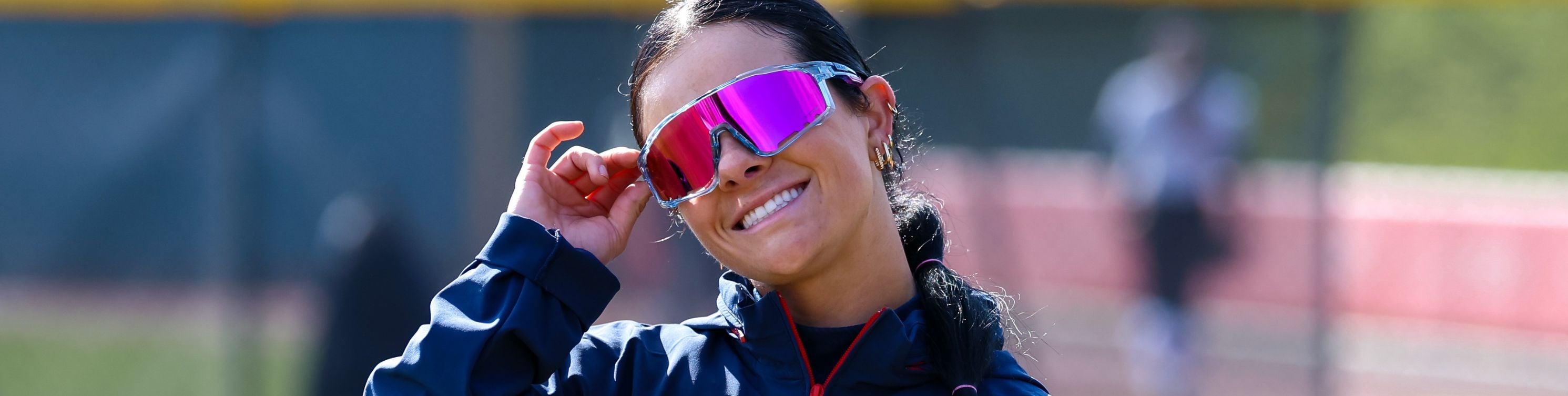 Ole Miss Softball Star Taylor Strain wearing Solaro Shades Cotton Candy softball sunglasses.