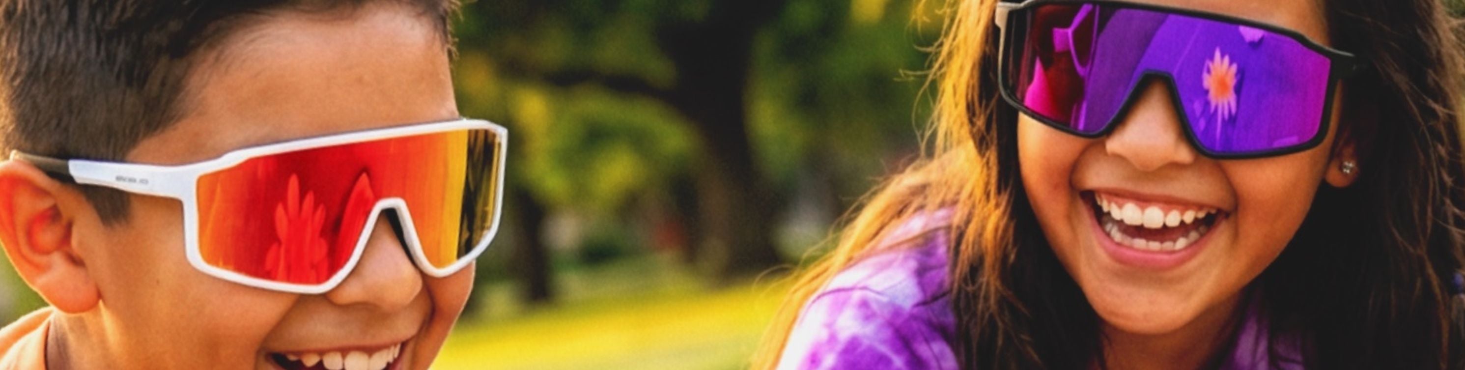 Two children wearing Soalro Shades kids sunglasses that are colorful sunglasses outdoors with a blurred natural background