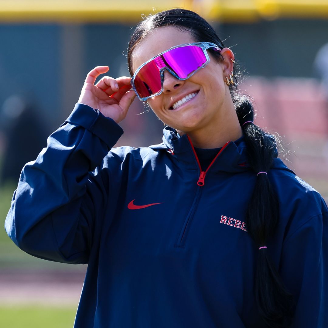 Ole Miss Softball Star Taylor Strain wearing Solaro Shades Cotton Candy softball sunglasses.