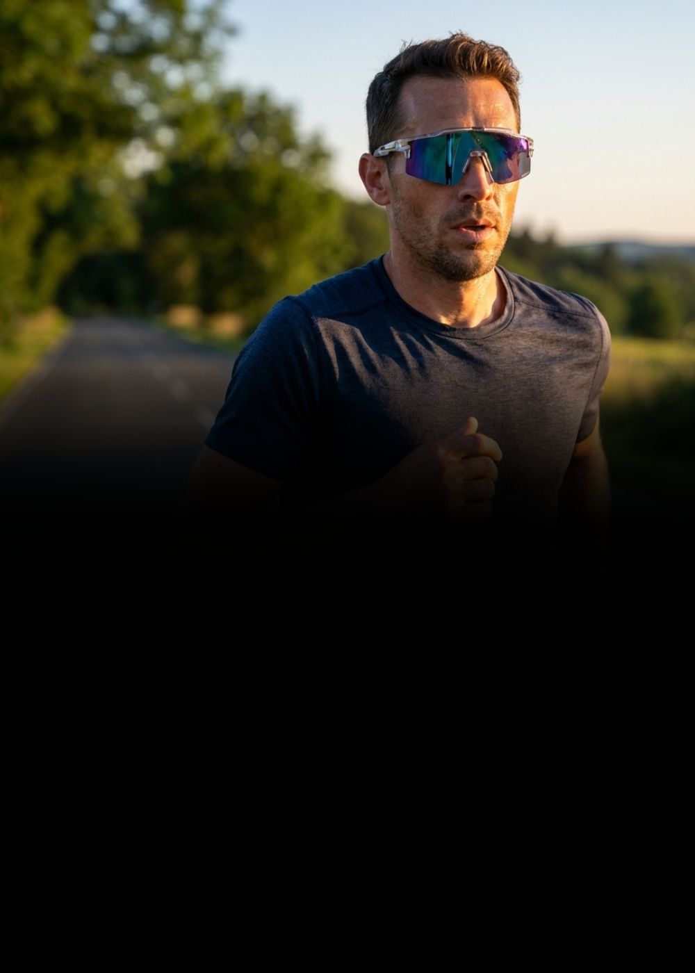 Man wearing Solaro Shades running sunglasses outdoors with a blurred background