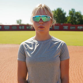 Solaro Shades Nova Sunglasses for Softball, baseball, pickleball, and running. Best sports sunglasses for women and men.  White frame and blue lenses. Graci Major is the model.