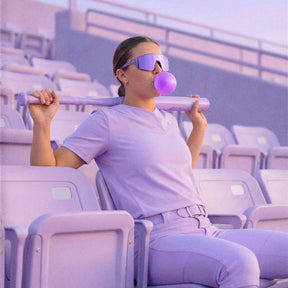 Woman wearing lavender purple baseball sunglasses by Solaro Shades.