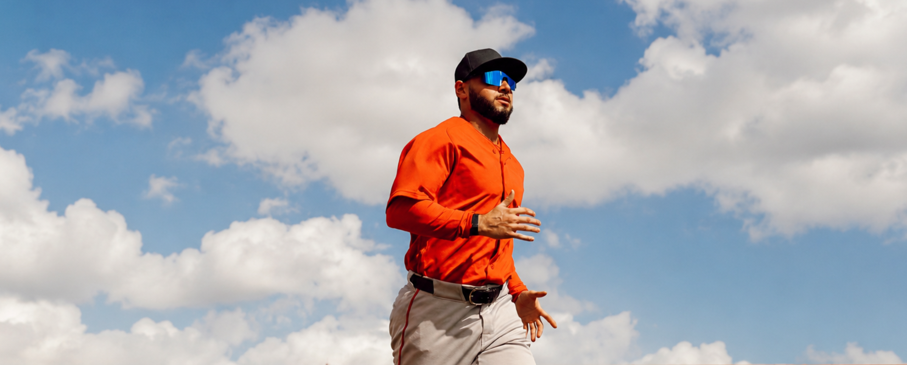 Professional baseball player Wilyer Abreu of the Boston Redsox runs across the baseball field wearing Midnight Blue Blaze baseball sunglasses by Solaro Shades. 