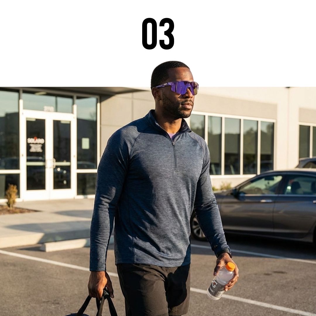 Man walking to his  car after leavingthe gym wearing Solaro Shades sports sunglasses.