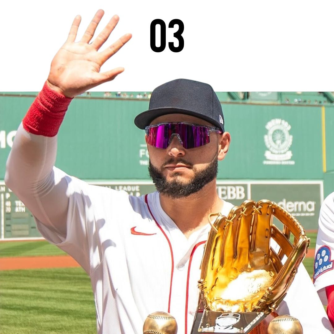 baseball sunglasses worn by a Baseball player holding a gold glove and waving on a baseball field