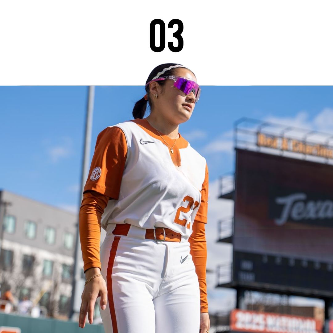 Person in  softball sunglasses and Texas sports uniform on a sports field with 'Texas' branding.