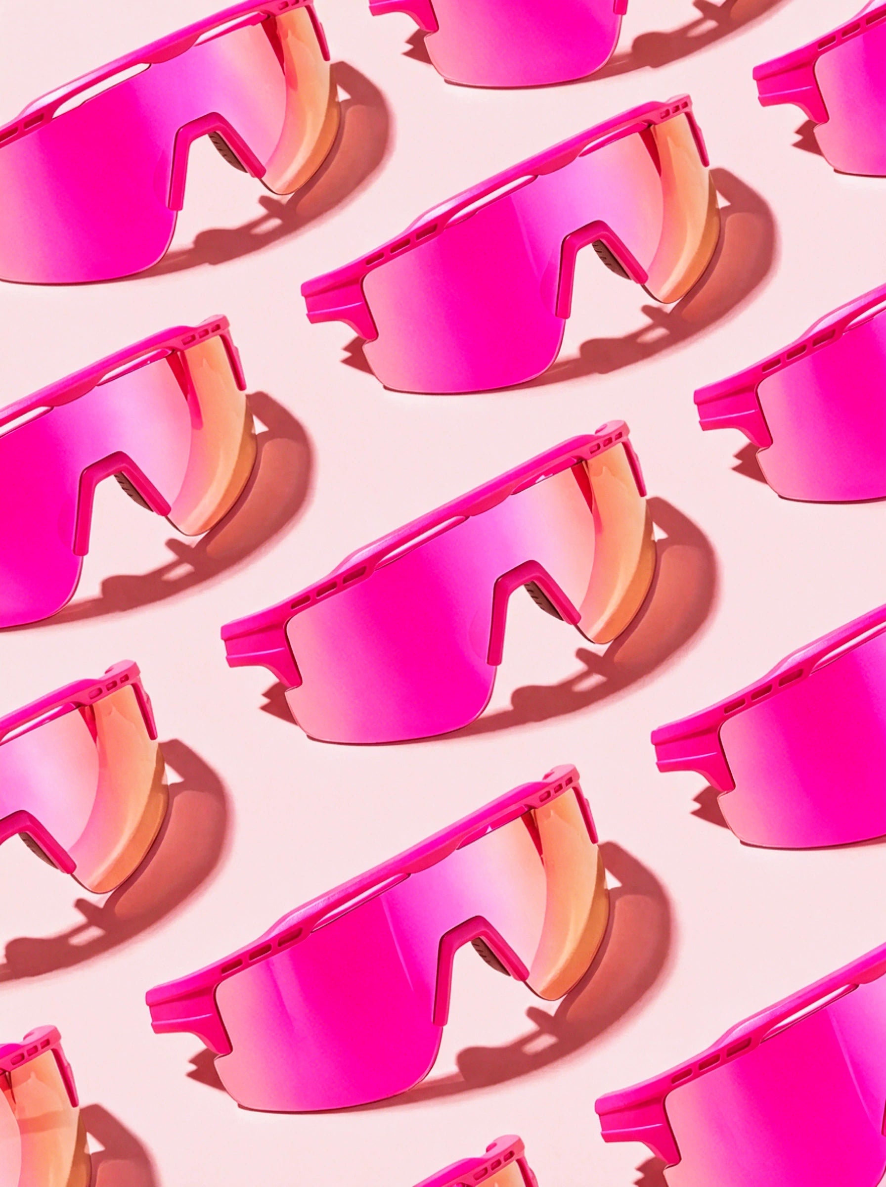 Pink Solaro sunglasses with mirrored pink and gold lenses in sunlight